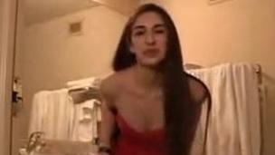 Brunette is posing in sexy dress in soft core porn
